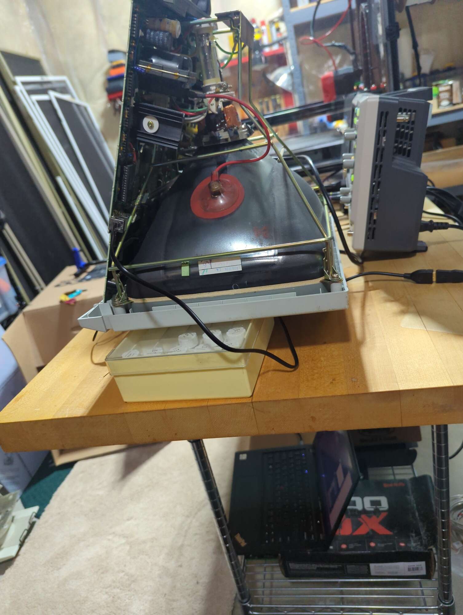 Picture of a half-open terminal face down lying on top of some containers